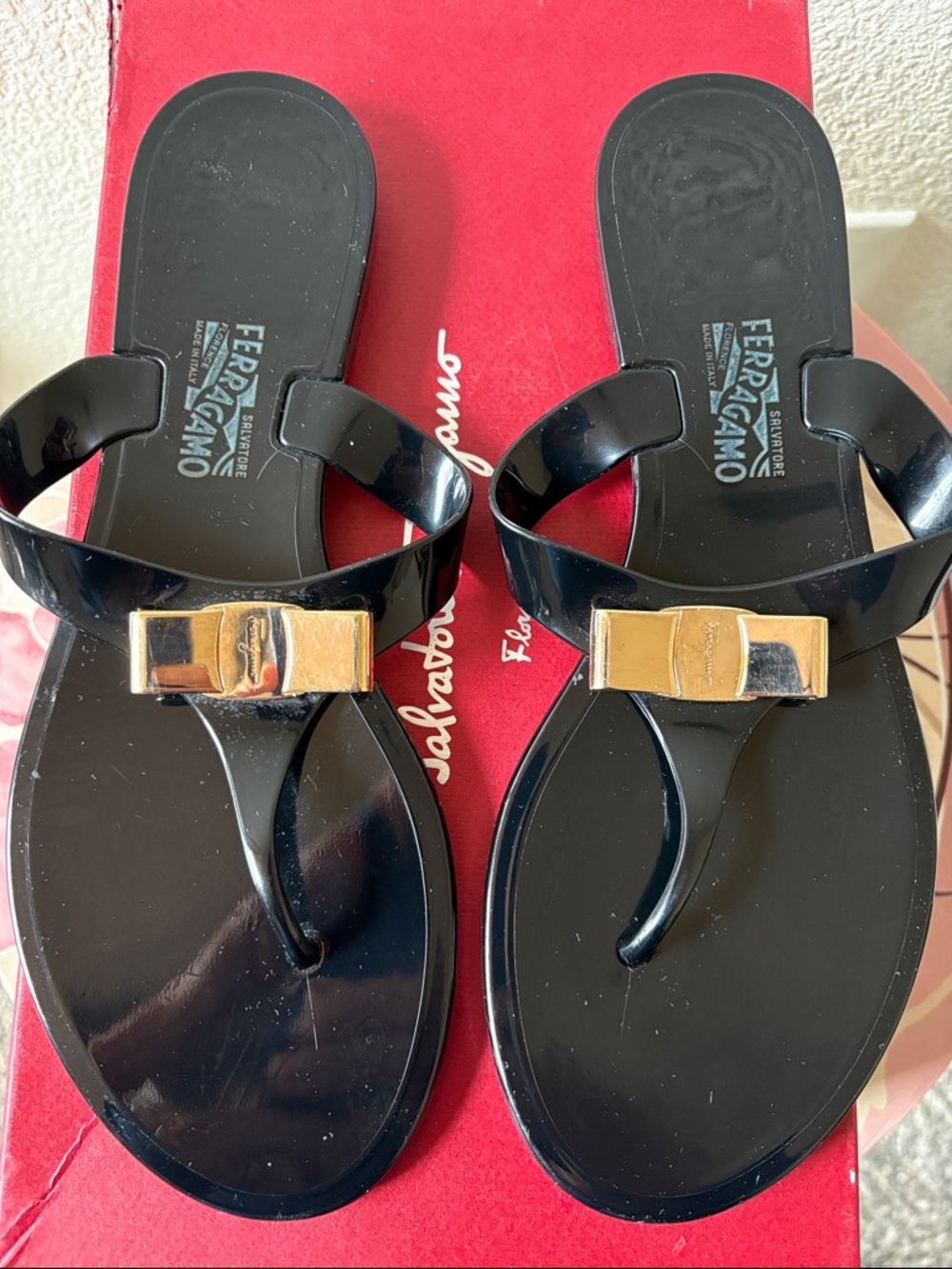 Salvatore Ferragamo Black Jelly Thong Sandals with Gold Bow